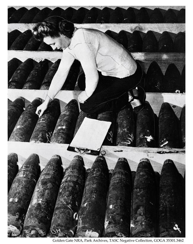 Woman inspecting missiles
