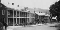 row of two-story historic barracks with porches row of two-story historic barracks with porches