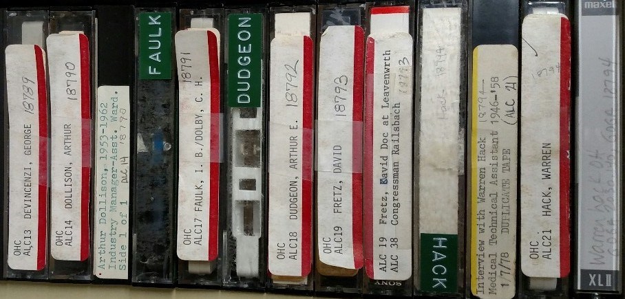 A row of cassette tapes from the oral history collections.