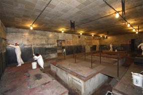 Volunteers priming the walls of the generator room