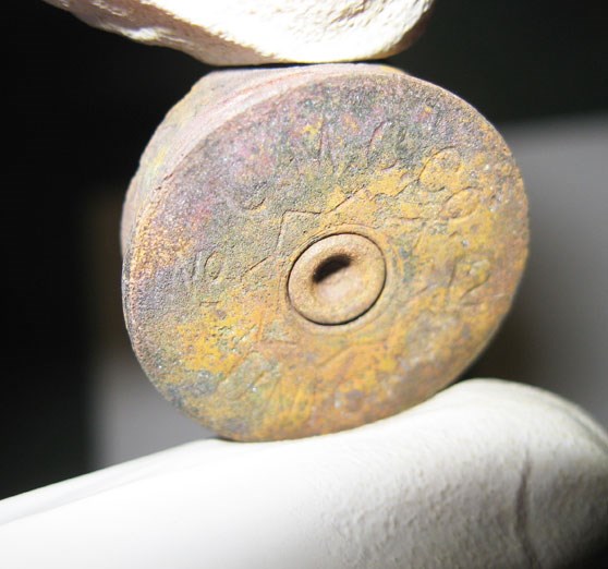 fragment of a 12" shot gun shell