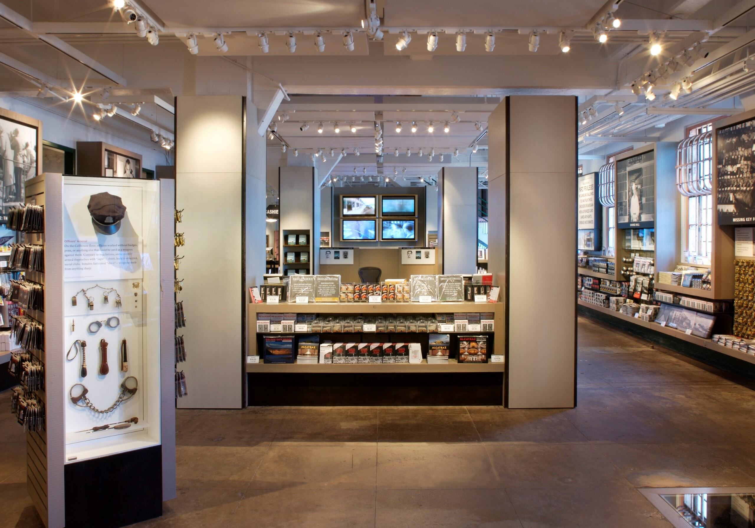 Interior of the Alcatraz Island store. magnets, keychains, books and other gifts line the walls and shelves. Images and ephemera from the prison era are also on display.