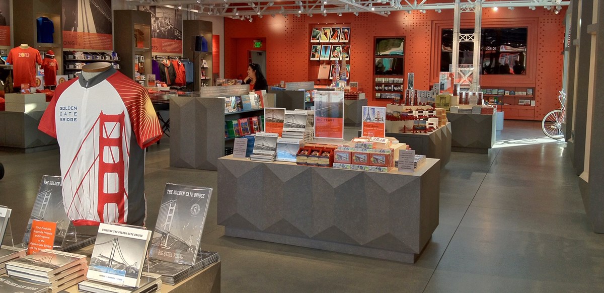 Interior of Golden Gate Welcome Center bookstore with tables of books, shirts and other merchandise