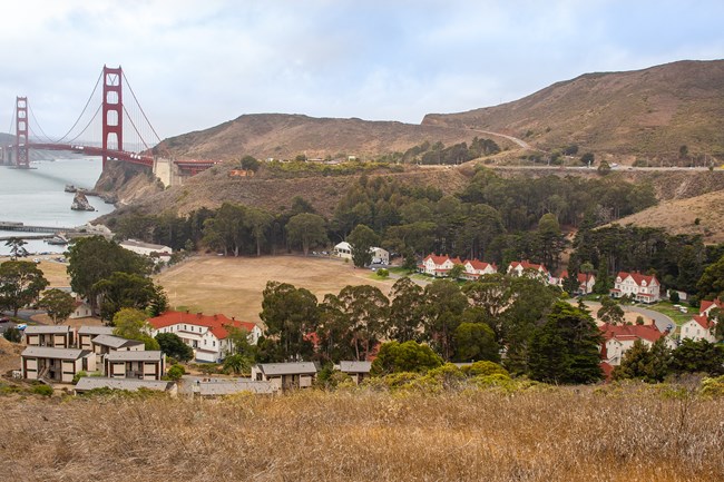 Overview of Fort Baker and Cavallo Lodge, with the golden hills and the Golden Gate Bridge in the background