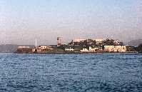 Alcatraz Island at sunset centered between sky and water