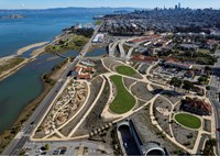 Color aerial view of San Francisco Bay, Presidio Tunnel Tops, Crissy Field, and Alcatraz Island.