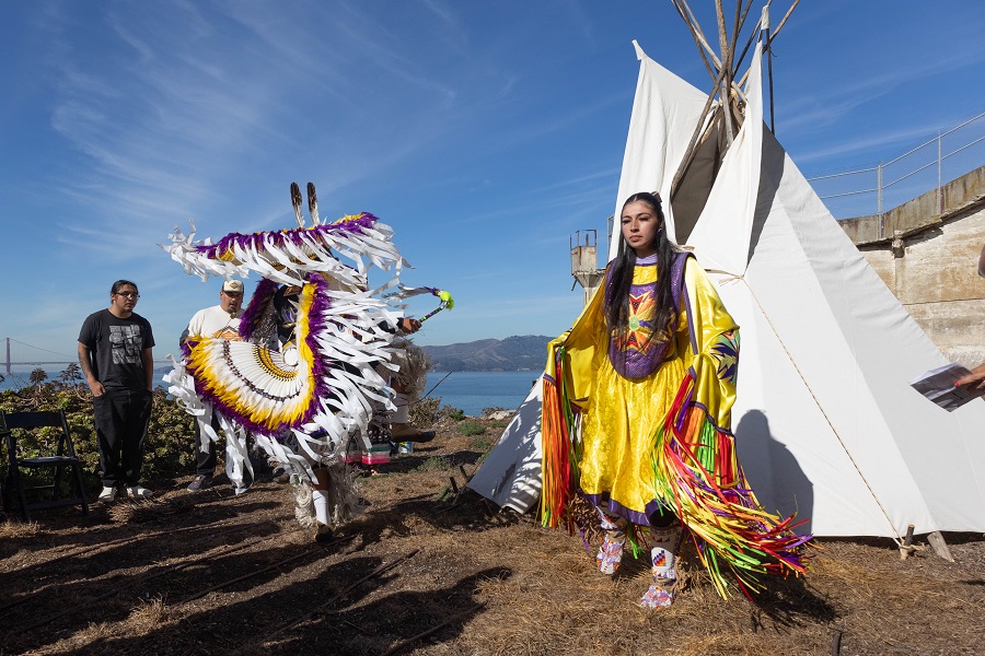 Two people dance in front of a tipi on Alcatraz Island Two people dance in front of a tipi on Alcatraz Island