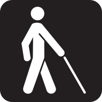 A silhouette of a person walking with a cane