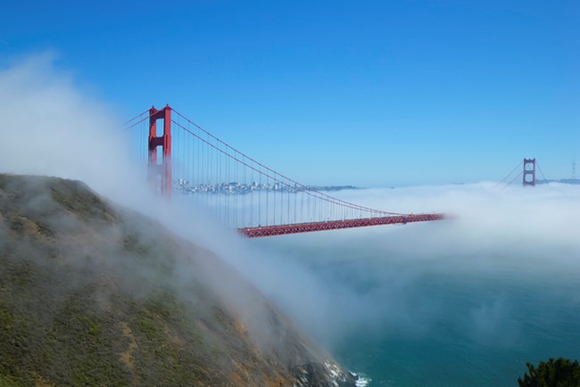 A view of the Golden Gate Bridge with fog from Battery Spencer. A view of the Golden Gate Bridge with fog from Battery Spencer.