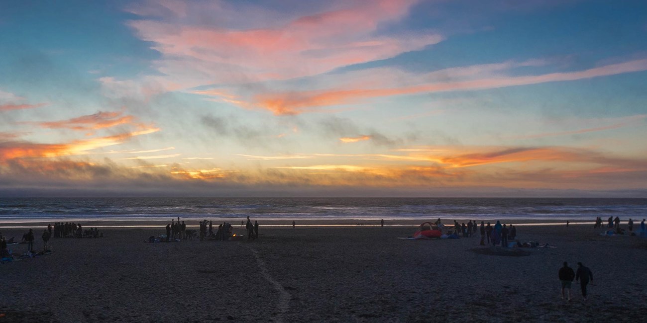 ocean beach fires at sunset