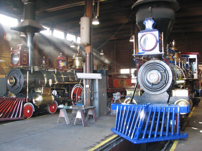 Locomotives No. 119 & Jupiter in the engine house. Locomotives No. 119 & Jupiter in the engine house.