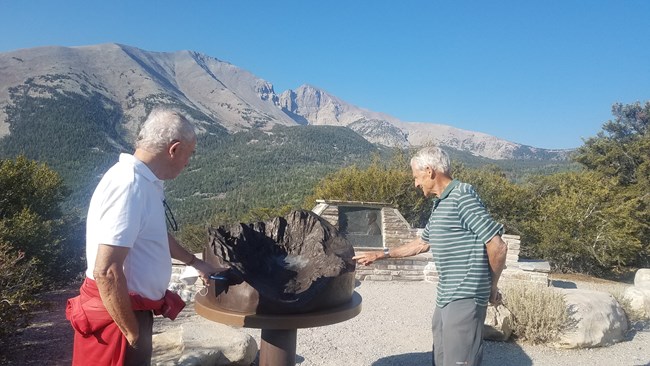 Visitor looking at a new exhibit at Mather Overlook
