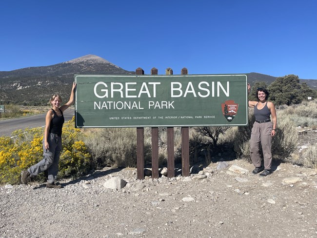 Crew at entrance sign