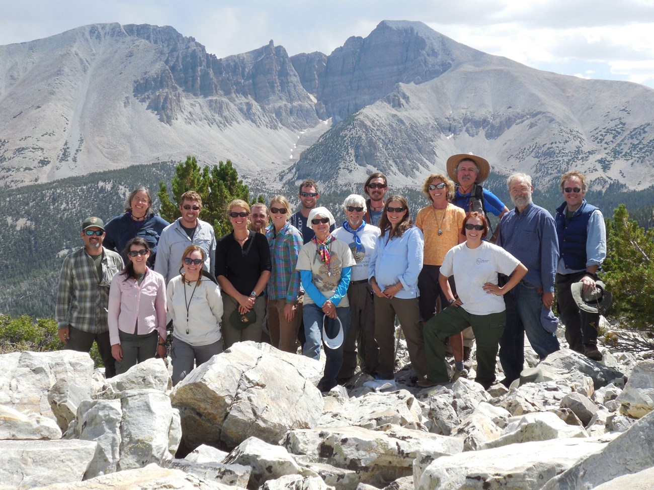 people with mountains behind