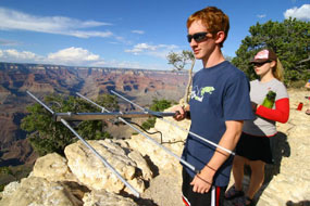 Boy holding telemetry device to monitor California condors.