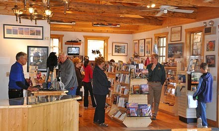 interior of north rim bookstore showing the checkout on the left and shelves with books on the right