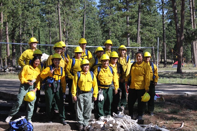 Group photo of the Women in Wildfire bootcamp members in fireline gear