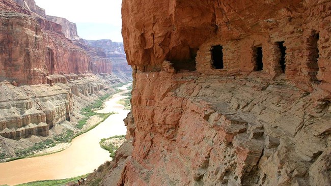 Ancestral Puebloan rooms built into the cliff side overlooking the Colorado River