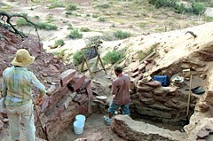 Archeologists excavating a site along the river.