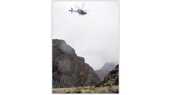 Park helicopter rescues boaters from Crystal Rapid.