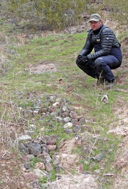 Examining a check dam built in the 1990's.