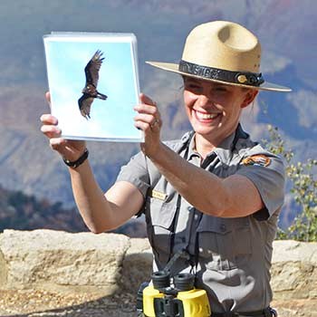 Ranger holds up a photo of a California Condor