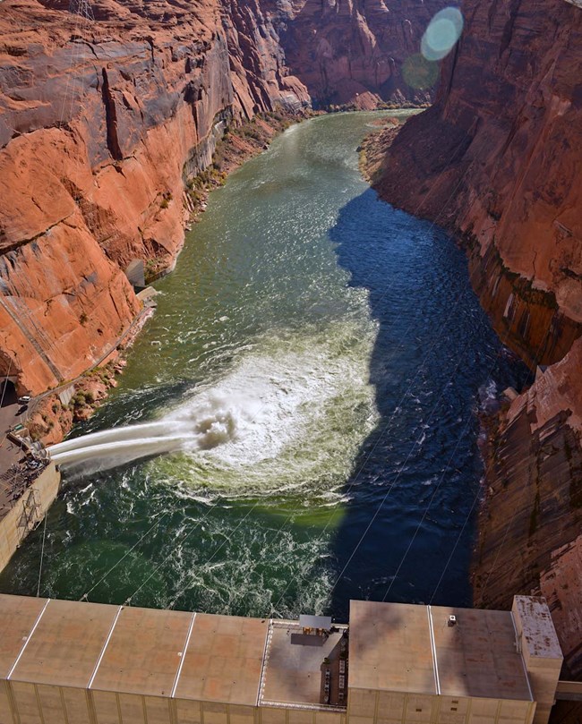 Looking down from Glen Canyon dam during 2012 HFE with tubes open.