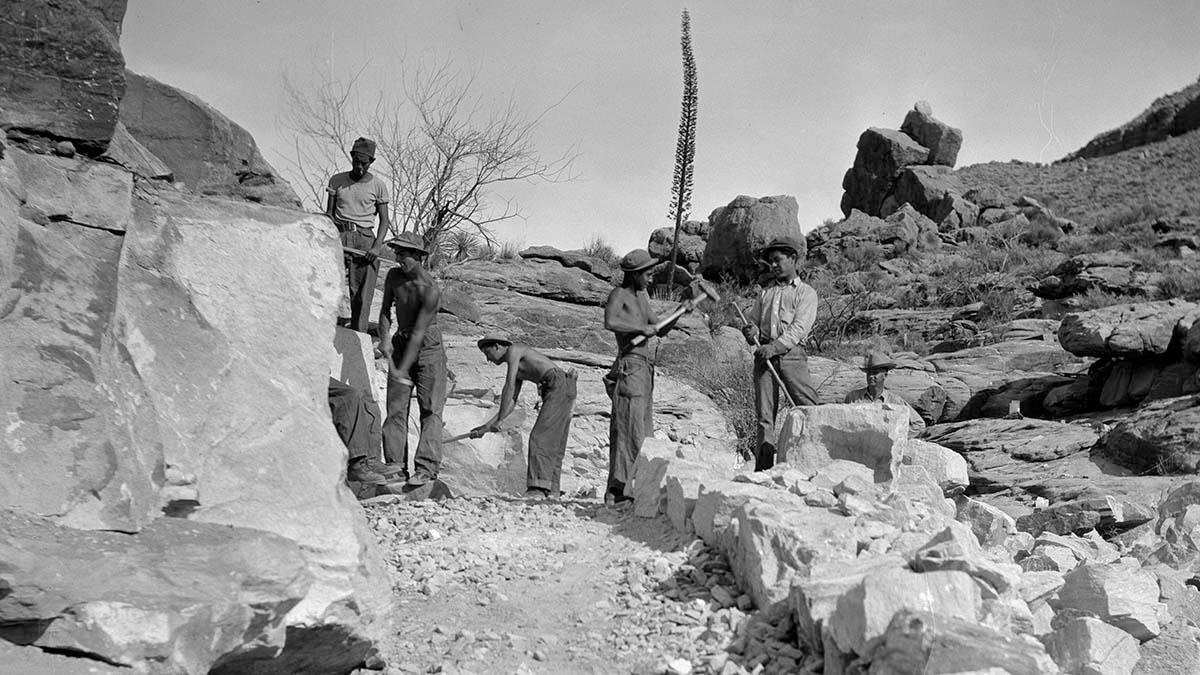 young African American men working on a trail