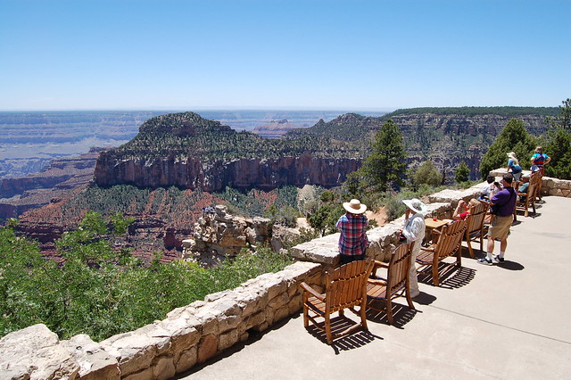 Visitors on porch of Grand Canyon Lodge.