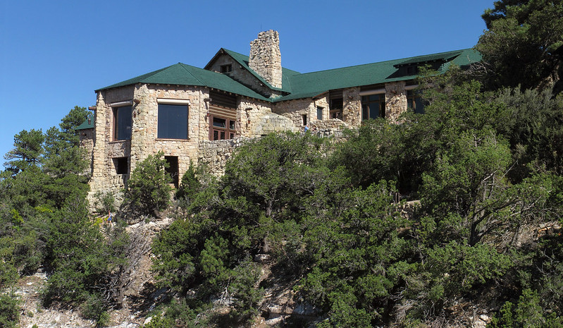 Front of Grand Canyon Lodge on North Rim A multi-level limestone building is perched on the edge of a canyon