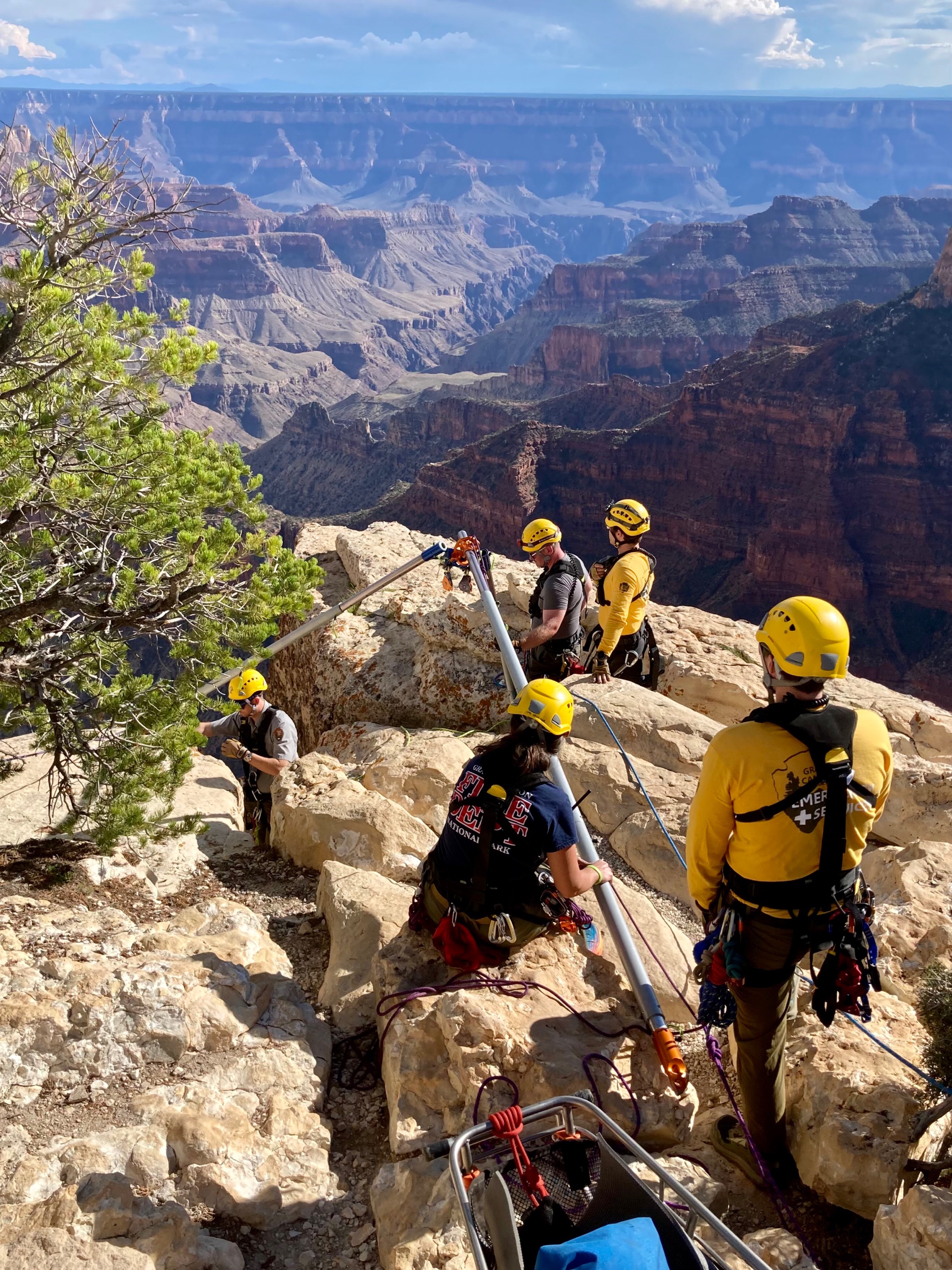A crew of rescuers manage ropes during a technical rescue at Bright Angel Point