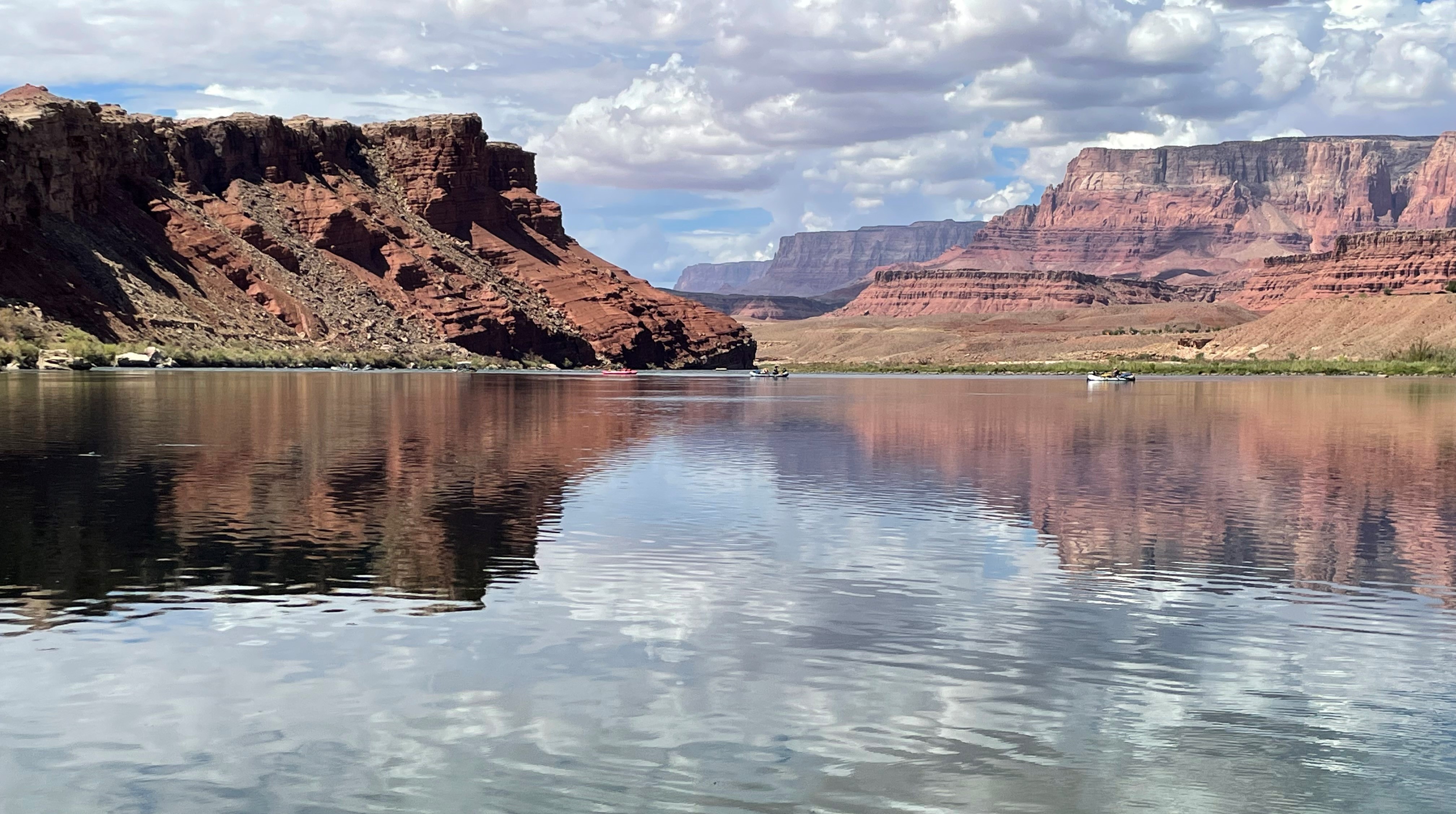 The Colorado River at Lees Ferry with several boats in the background