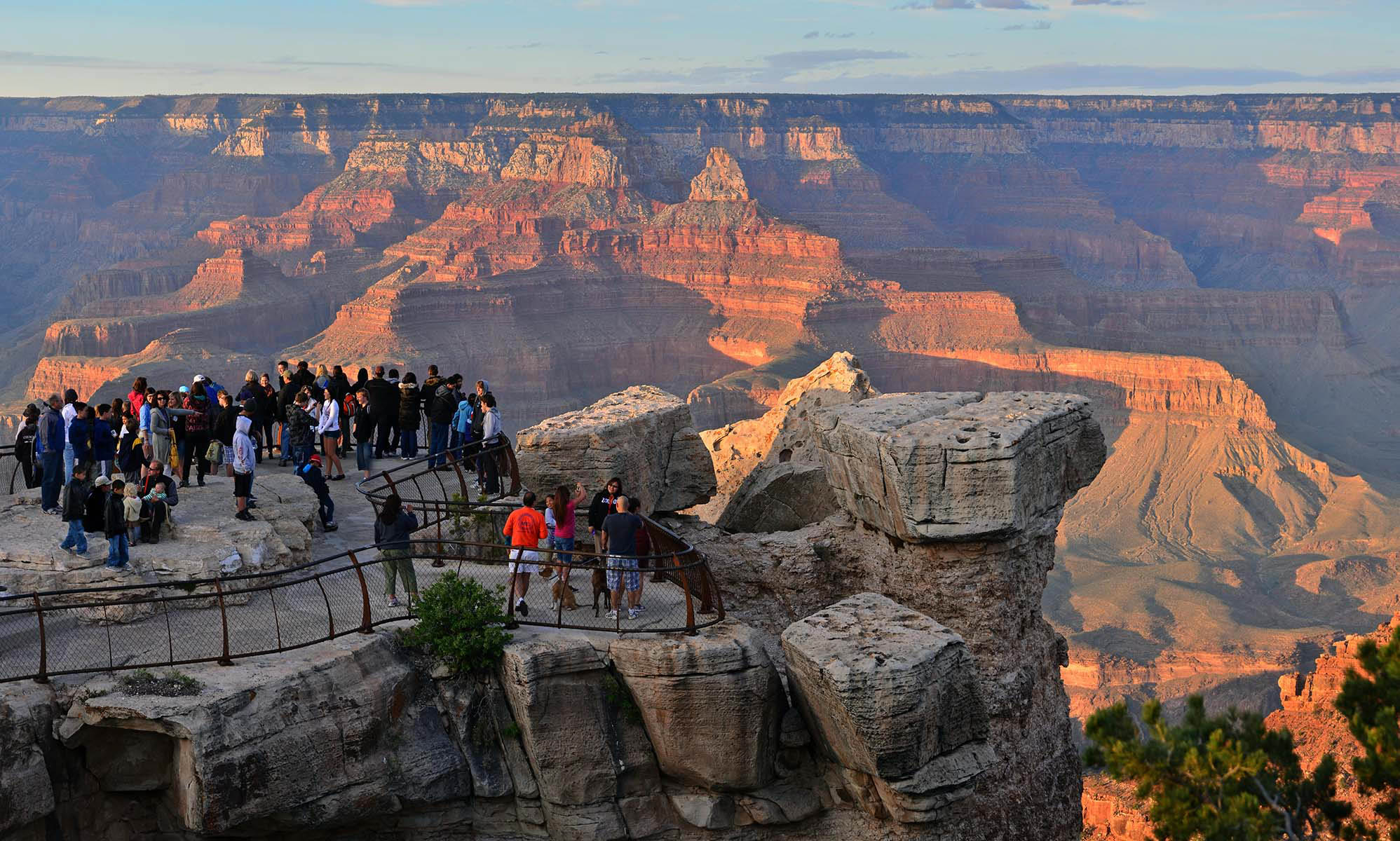 A group of visitors admiring a scenic overlook.