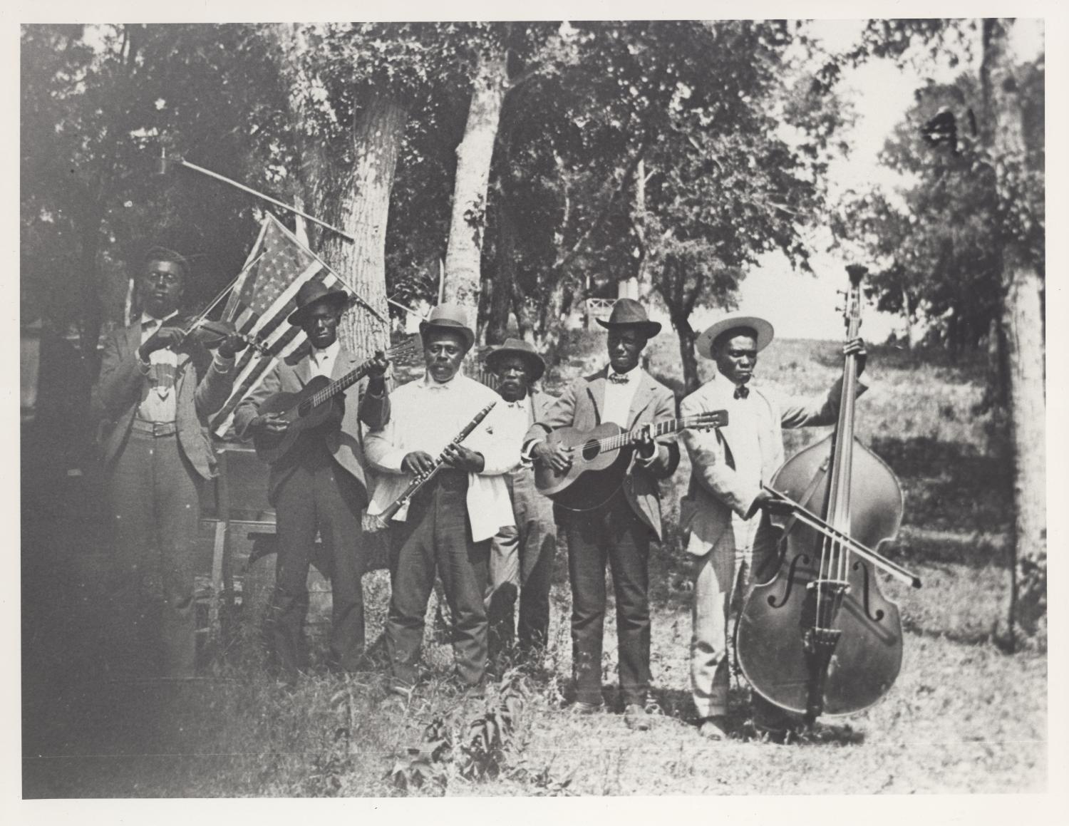Emancipation Day Celebration band, June 19, 1900, Texas Photograph of African-American band at Emancipation Day celebration, June 19, 1900, held in "East Woods" on East 24th Street in Austin.