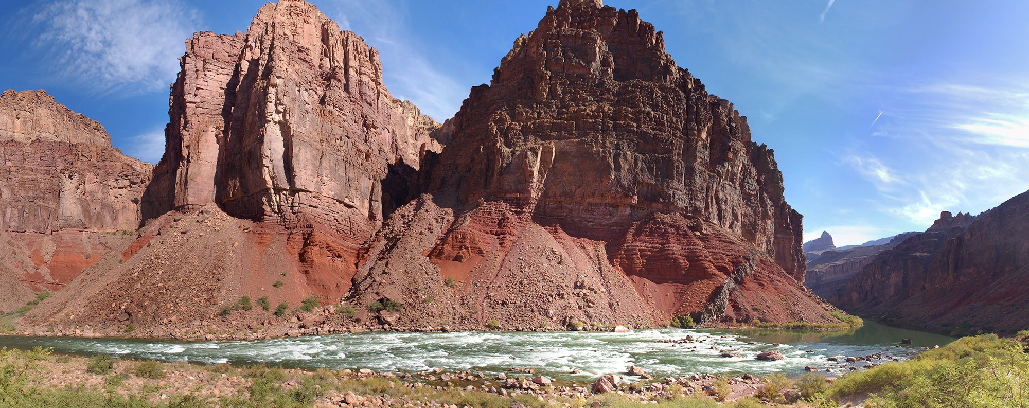 Hance Rapid with tall canyons above
