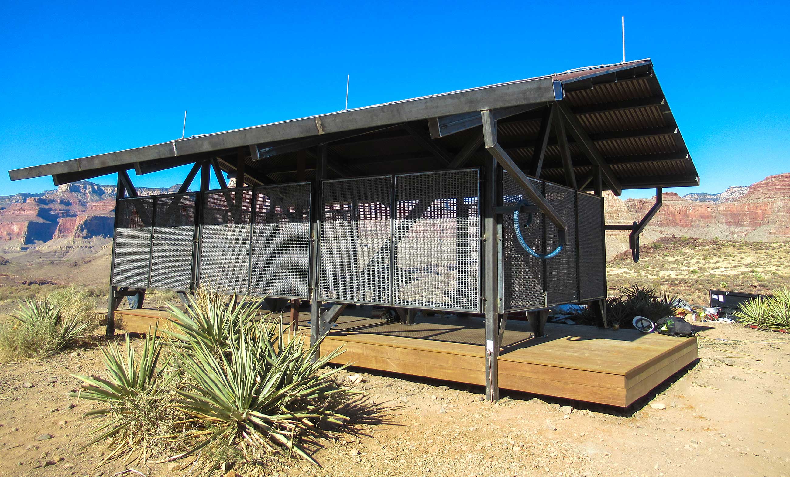 a 12 x 24 foot open-sided shade structure, with canyon walls in the distance.