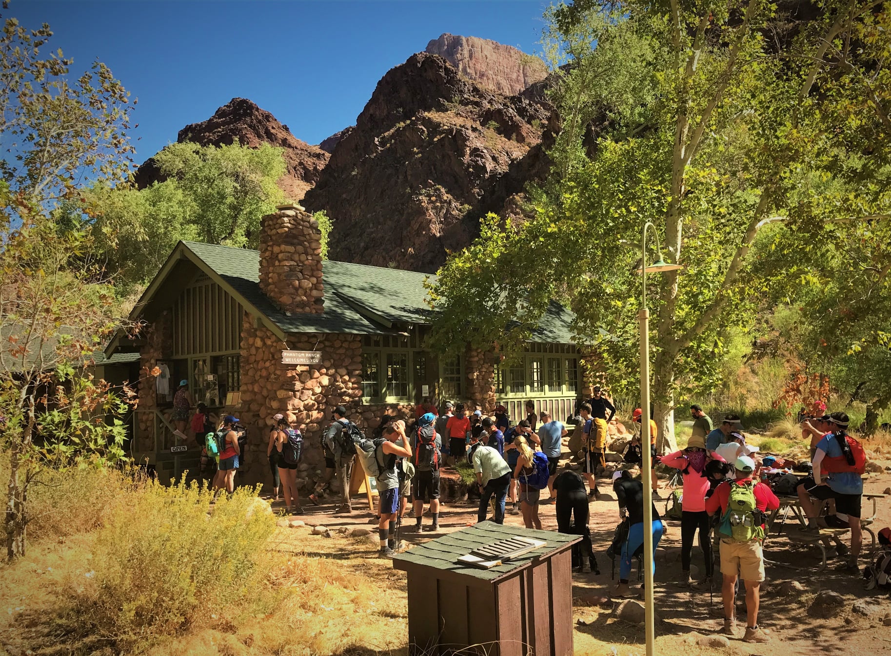 Many visitors gather around the Phantom Ranch canteen at the bottom of Grand Canyon