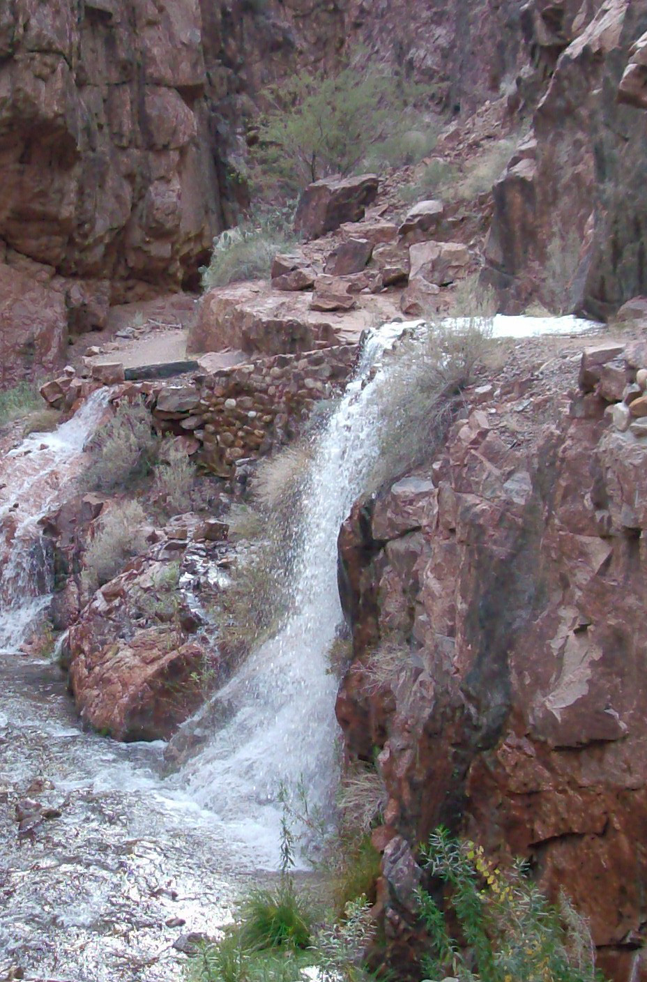 Water floods the North Kaibab Trail during a pipeline break incident.