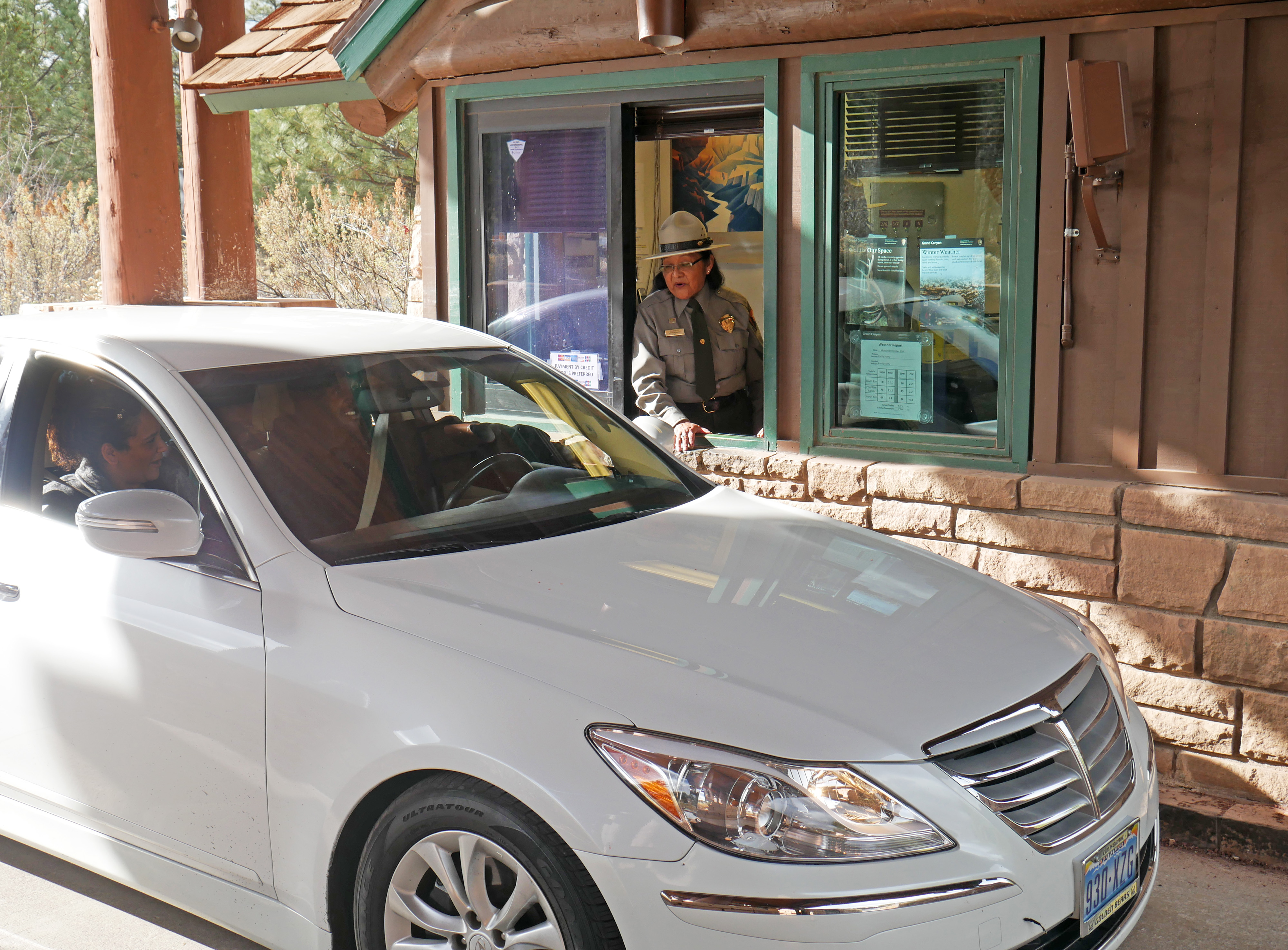 Grand Canyon park staff greeting visitor at South Entrance gate