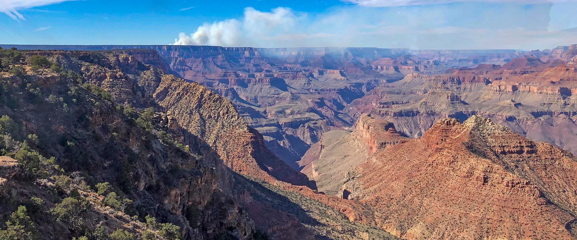 A wildland fire with smoke is seen near Grandview Point