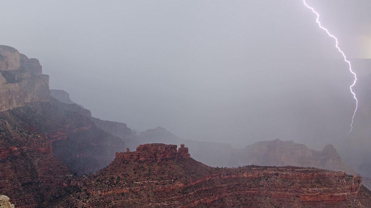 Lightning strikes the cliffs and buttes of Grand Canyon