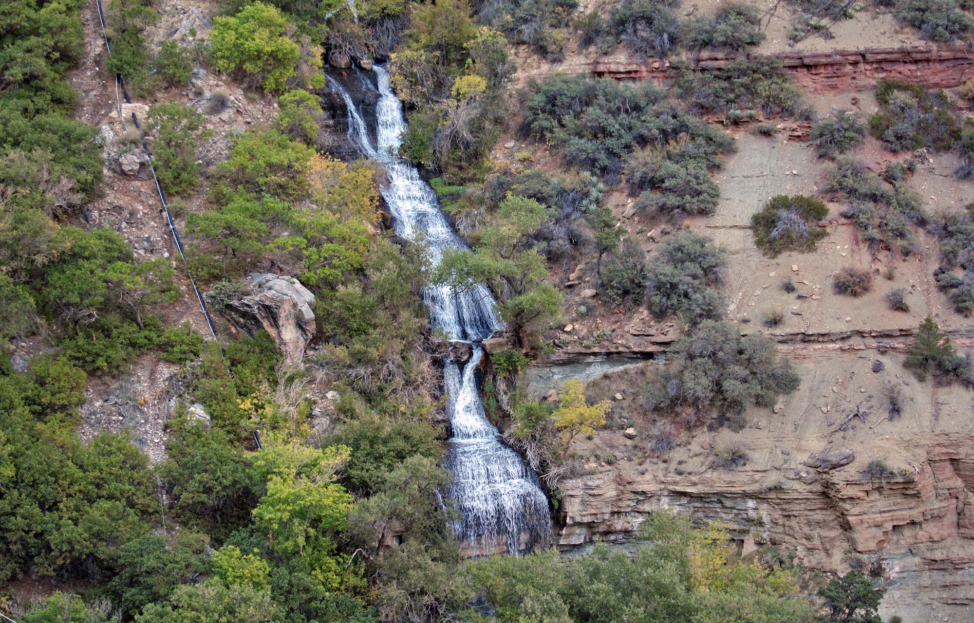 water rushes out of roaring springs canyon