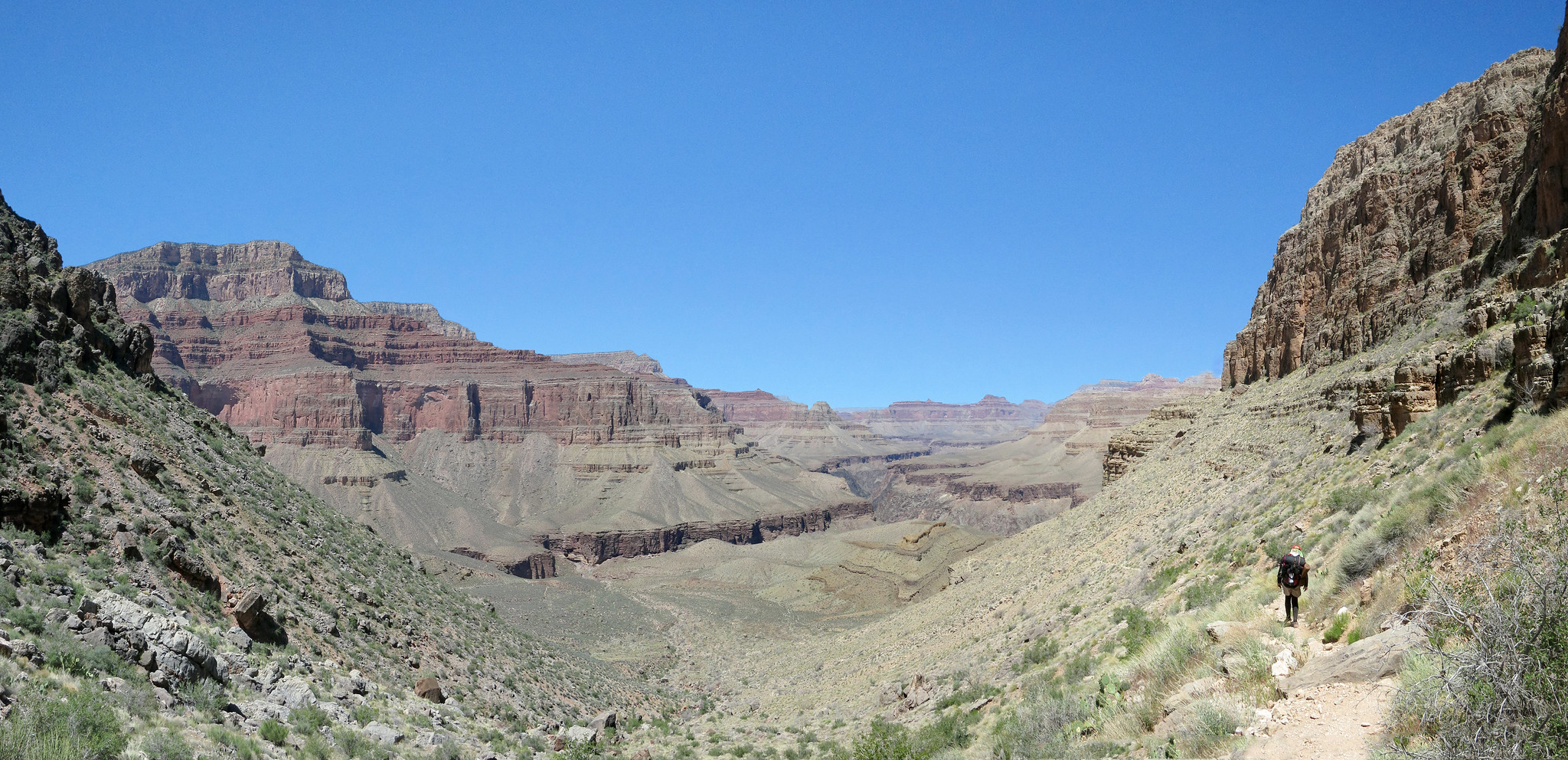 A hiker descends down the Hermit Trail below the 'Cathedral Stairs.'