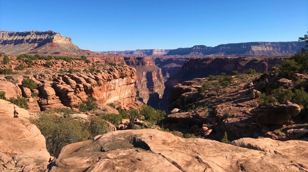 A canyon landscape with little shade is seen along the Esplanade layer at Tuweep