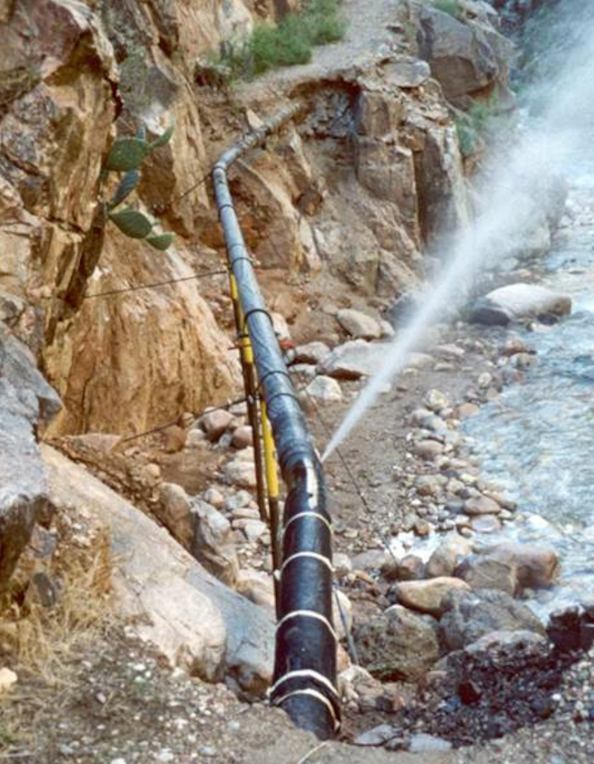 Water shooting out of the transcanyon waterline a gush of water spews out of a broken transcanyon waterline