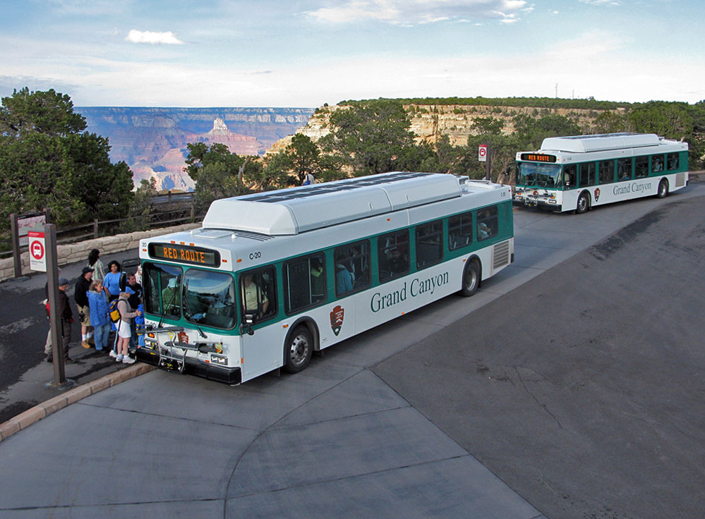 Two shuttle buses stop at the Mohave Point shuttle bus stop along the Hermit Road