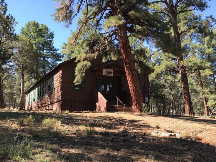 The historic Grand Canyon Community Library A photo of an historic log building that looks like a schoolhouse