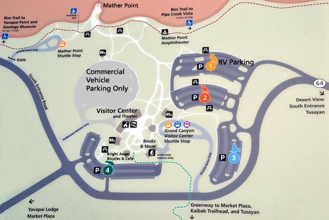 Grand Canyon Visitor Center Parking Map shows the highway making a turn to the left and forming a large "u" shape around four large parking lots with the Visitor Center plaza surrounded by the parking lots.