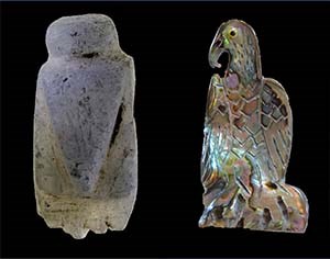 two fetish carvings in the shape of an eagle. one the left, very simple, traditional rendering. On the right, a more realistic version by a contemporary artist