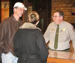 Visitors talking to park ranger at Verkamp's Visitor Center